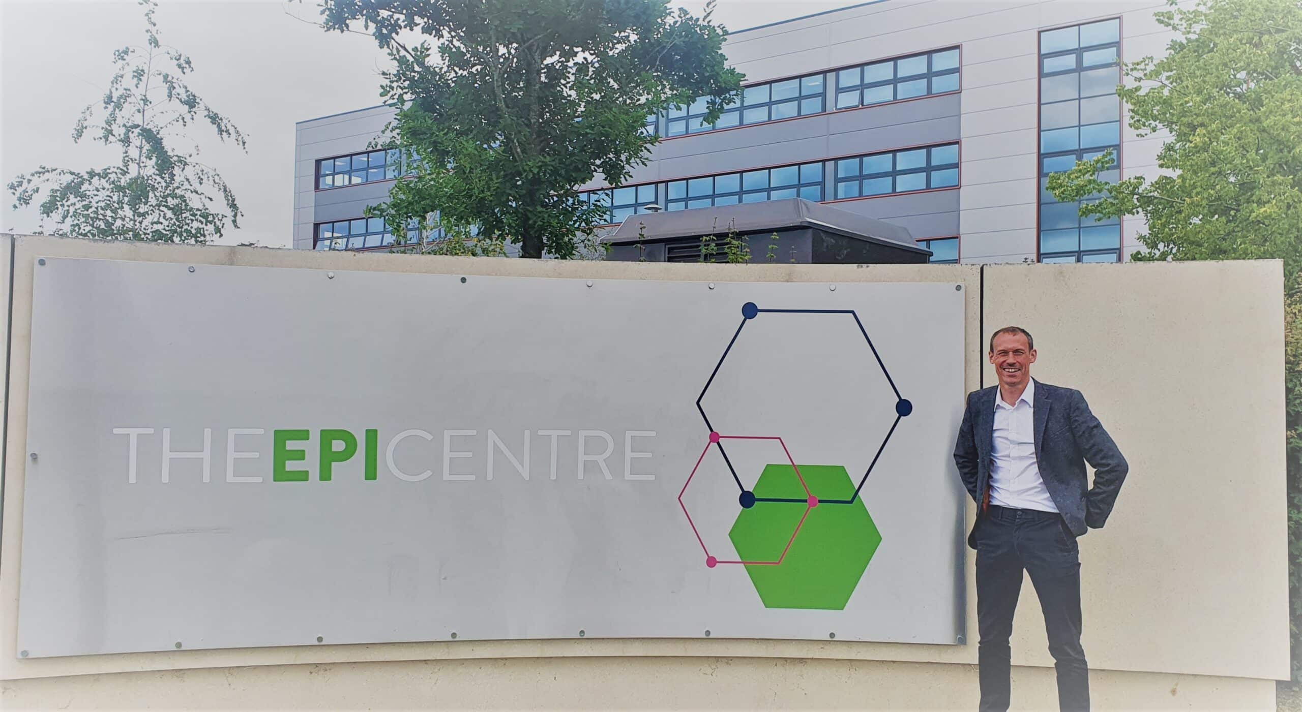 Andrew Bell Stood Next to EpiCentre Sign